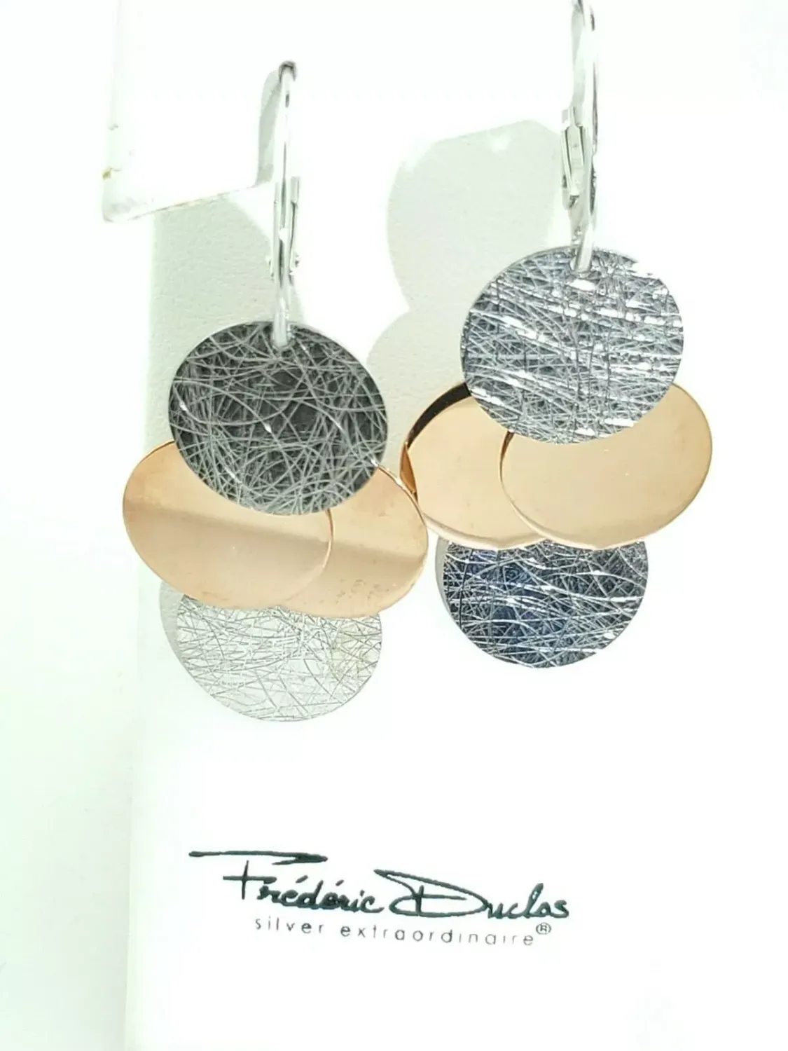 Frederic Duclos designer Sterling Silver and Rose Gold plated coin earrings. Lever back