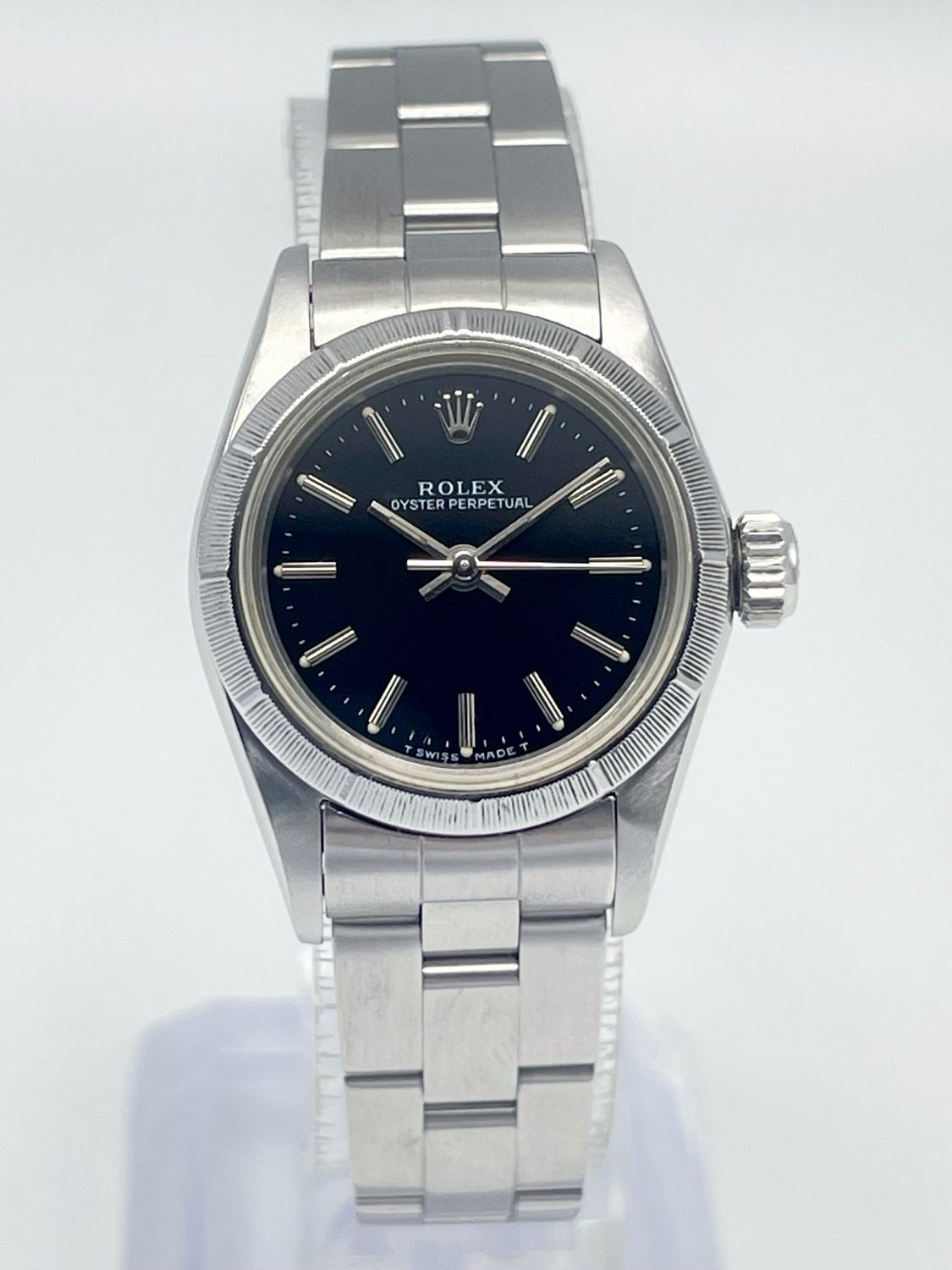 Rolex Oyster Perpetual 67230 24mm Black Baton Dial Engine-Turned Bezel Papers