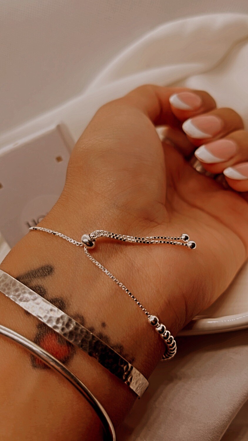 Pulsera corbatín esferitas