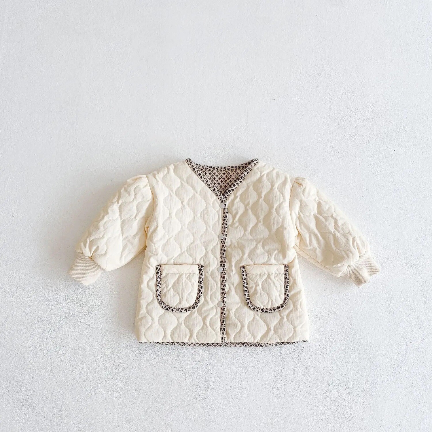 Campera capitoneada reversible