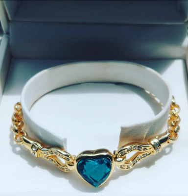 Gold tone bracelet with cubic zirconia blue heart
