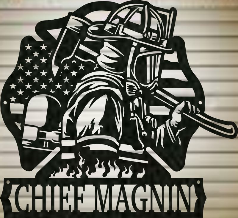Close-up of a black firefighter metal sign with American flag, Maltese cross, and personalized CHIEF MAGNIN lettering.