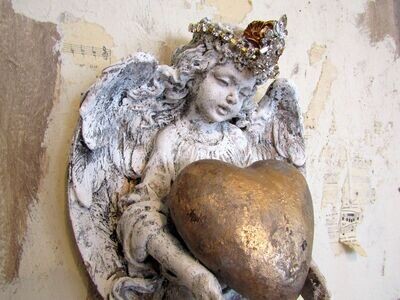 SOLD Vintage angel wall sculpture holding handmade heart