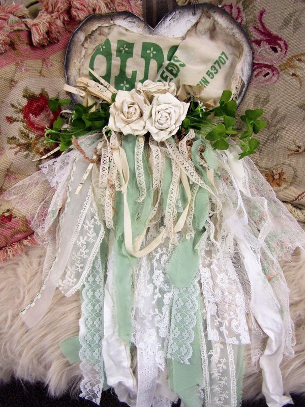 Tattered heart wall decor with four leaf clovers handmade aged look paper roses wall hanging, faded seed sack fabric anita spero design