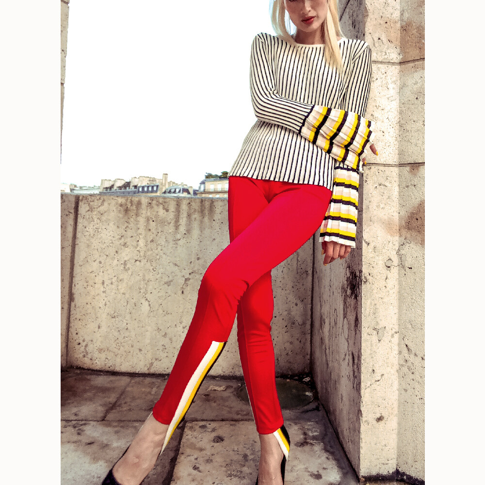 Women&#39;s red leggings with colorful side stripes
