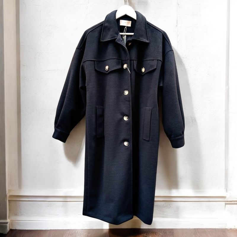 Black wool coat for women, classic collar, puffed sleeves, and button closure