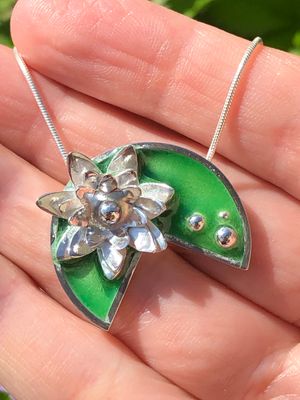 Green enamelled waterlily pendant in silver