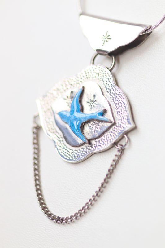 Moroccan Cloud Swallow Pendant in Sterling Silver and Enamel Sterling silver and blue enamel swallow on a textured silver background