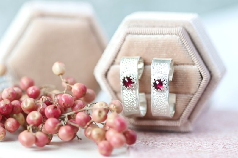 Garnet scroll earrings in sterling silver.