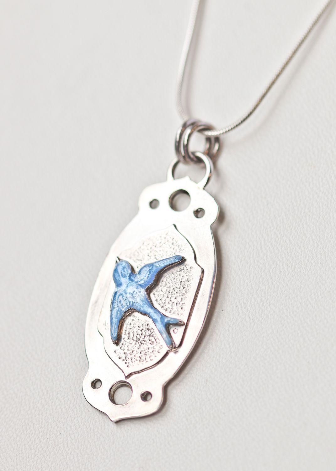 Moroccan-inspired blue swallow silver and enamel pendant