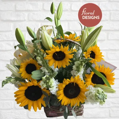 Cesta de girasoles lirios y dragones