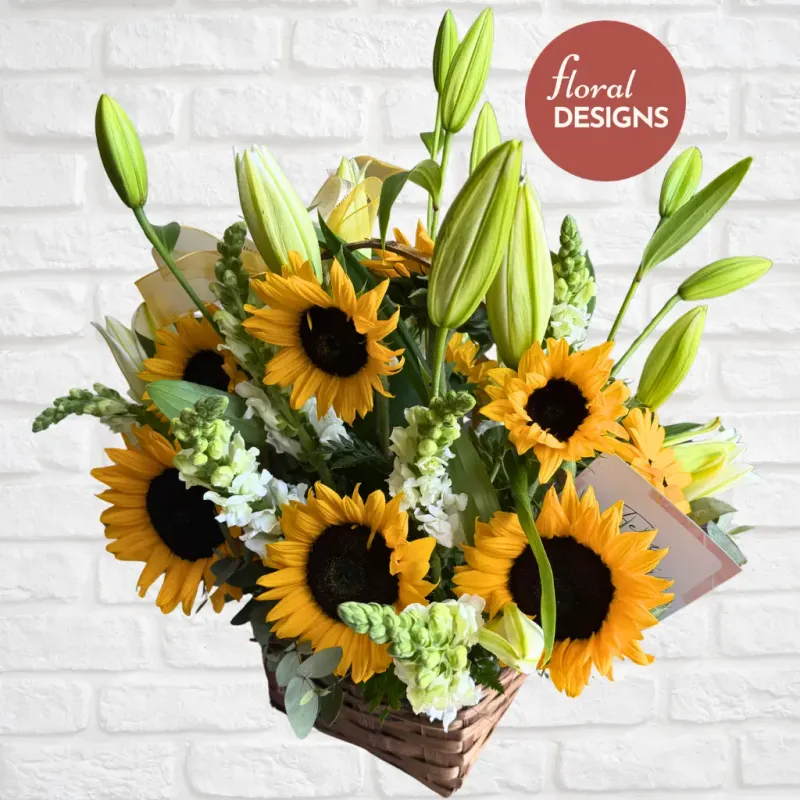 Cesta de girasoles lirios y dragones