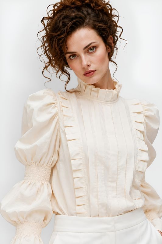 Creme blouse with puffy sleeves