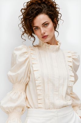 Creme blouse with puffy sleeves