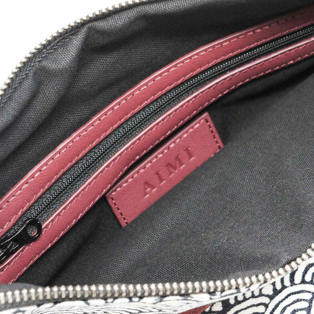 Pochette convertible Cuir bordeaux et tissu à motif MIU