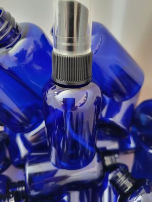Bottle PET Boston Round Blue 2 ozs with fine mist
