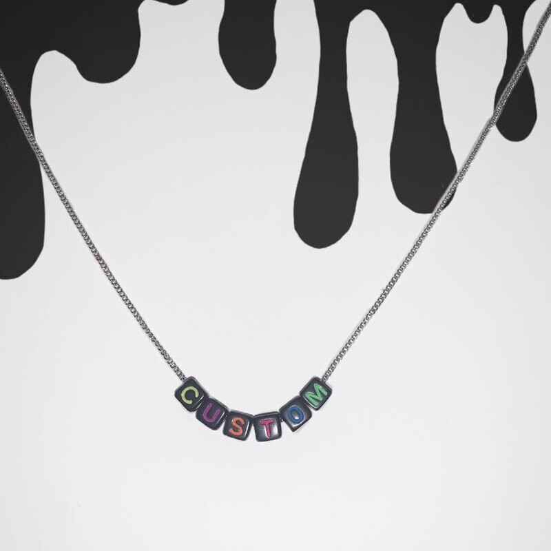Black bead with multicolour lettering
