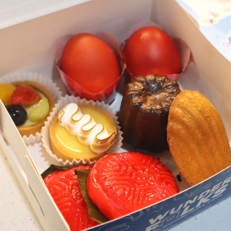 Baby Full Month Gift Box with a mix of red egg, Ang Ku Kueh, Mini Tart, Canele and Madeleine