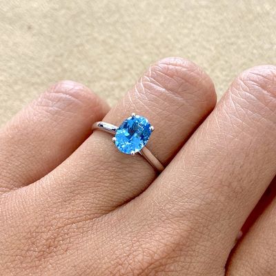 Oval Shaped 1.5 ct Blue Topaz, Four Prongs Ring