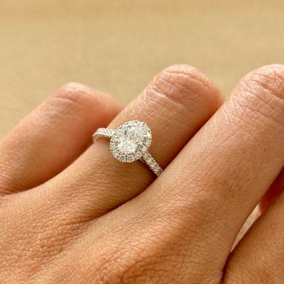 GIA Certified, Oval Shaped 0.5 ct, Halo Style Diamond Engagement Ring