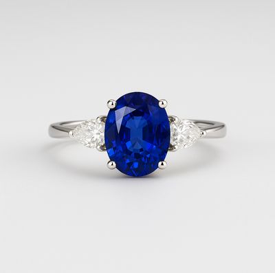 Oval Shaped 1.5 ct Blue Sapphire Flying Love Diamond Ring