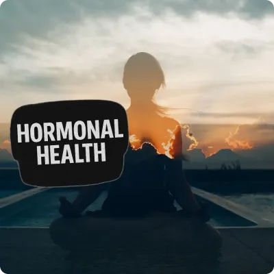 Silhouette meditating at sunset with Hormonal Health text, featuring supplements from top brands for balance and wellness.