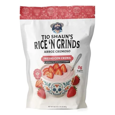 Tío Shaun's Rice 'N Grinds Arroz Cremoso Fresas Con Crema, Pride Foods product, white bag with red accents and strawberries on packaging.