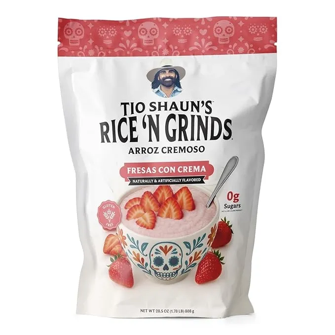 Tío Shaun's Rice 'N Grinds Arroz Cremoso Fresas Con Crema, Pride Foods product, white bag with red accents and strawberries on packaging.
