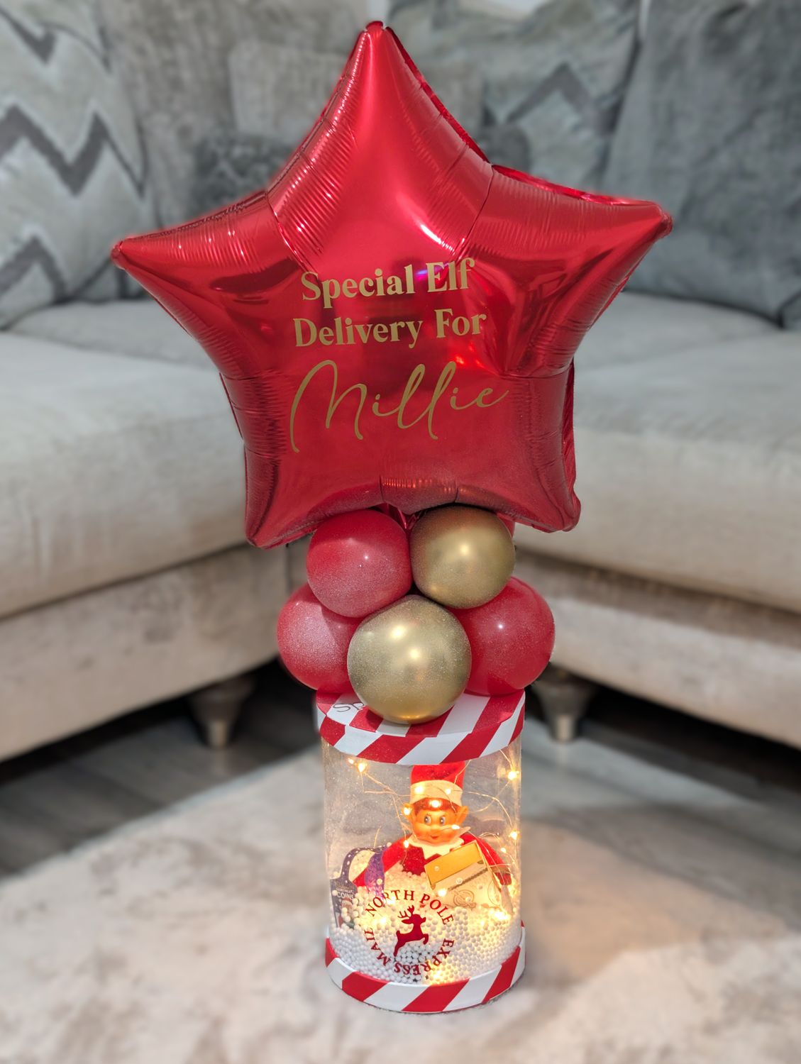 Elf Arrival Light Up Snow Cylinder Display