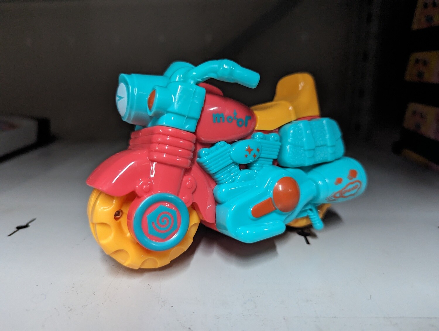 MOTOCYCLETTES A FRICTION DANS PRÉSENTOIR DE 12 (A10-1)(ETE)