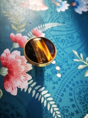 Golden brown tiger eye and brass drawer pull