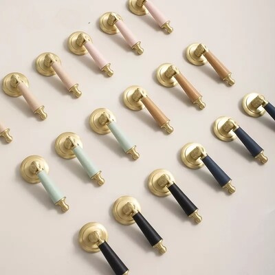 Pastel shade leather and gold brass drop cabinet pull