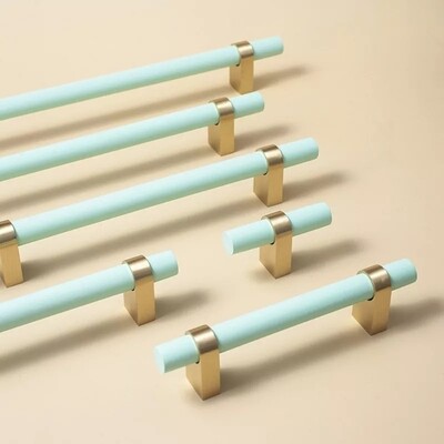 Mint green painted wood and brass cabinet bar pulls