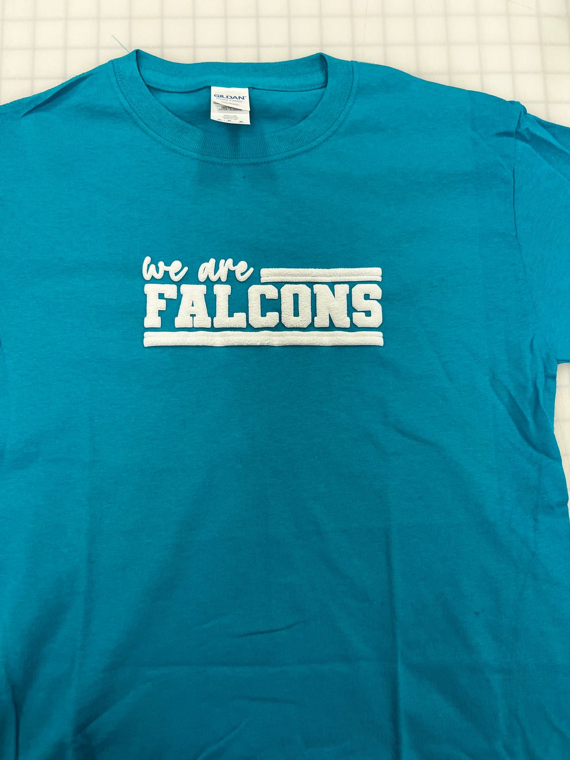 (Youth Medium) We Are Falcons Puff White   - Short Sleeve Teal