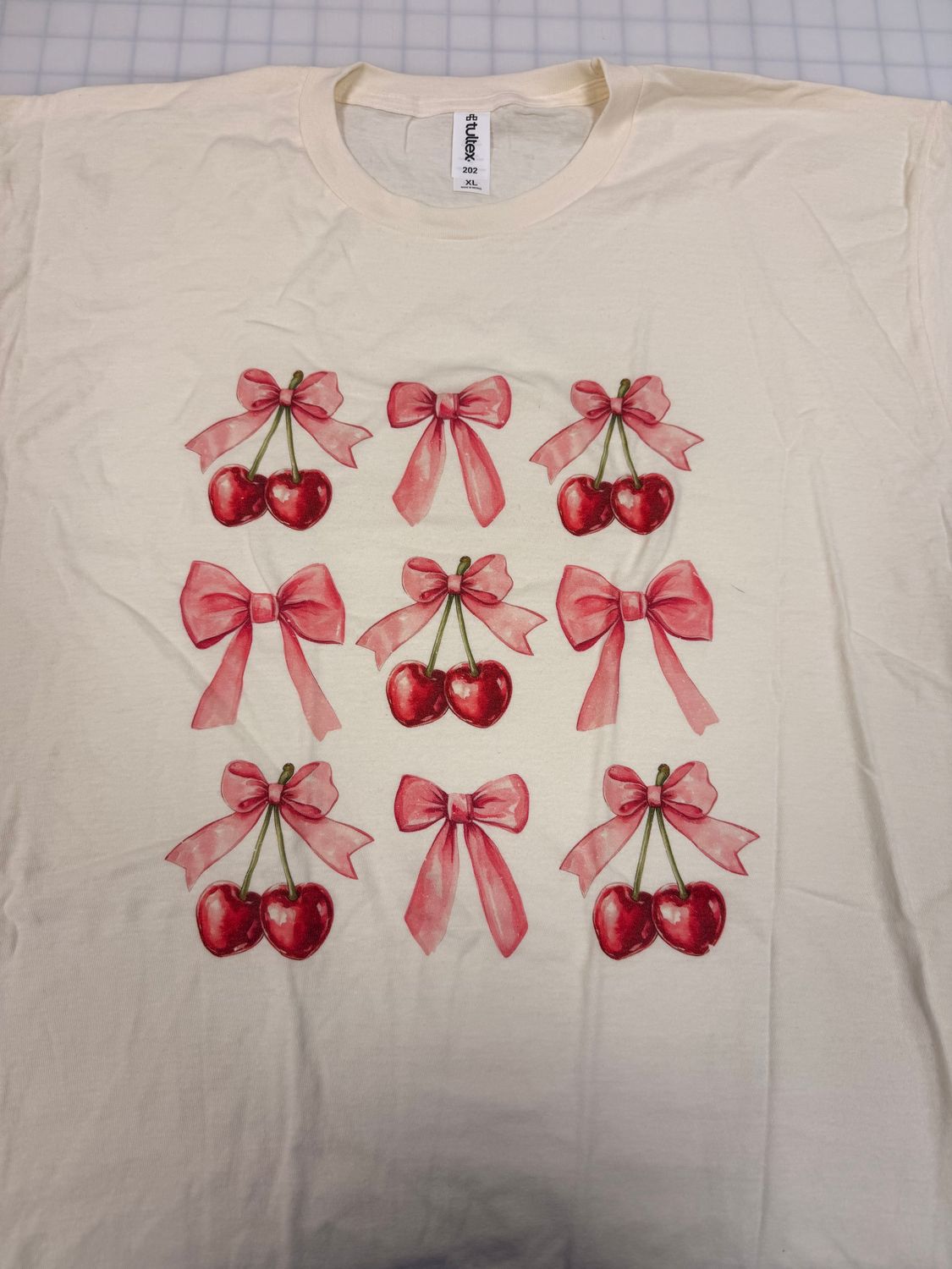 (XL) Cherry Bow - Short Sleeve Natural