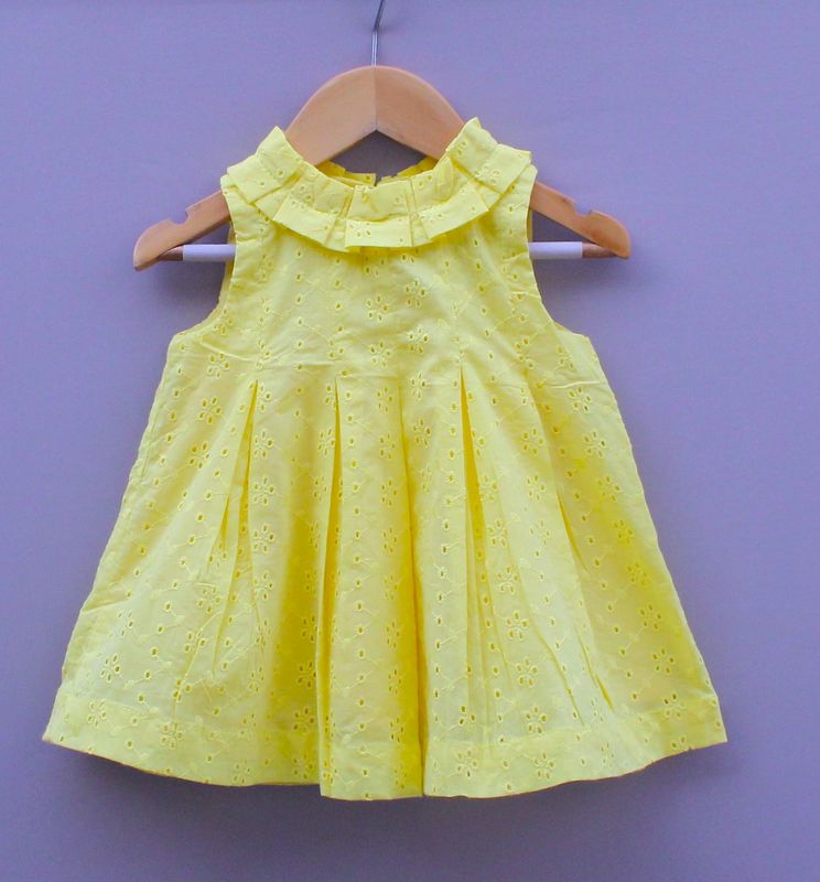 Yellow Sleeveless Cotton Frock with chikan Eyelet Design