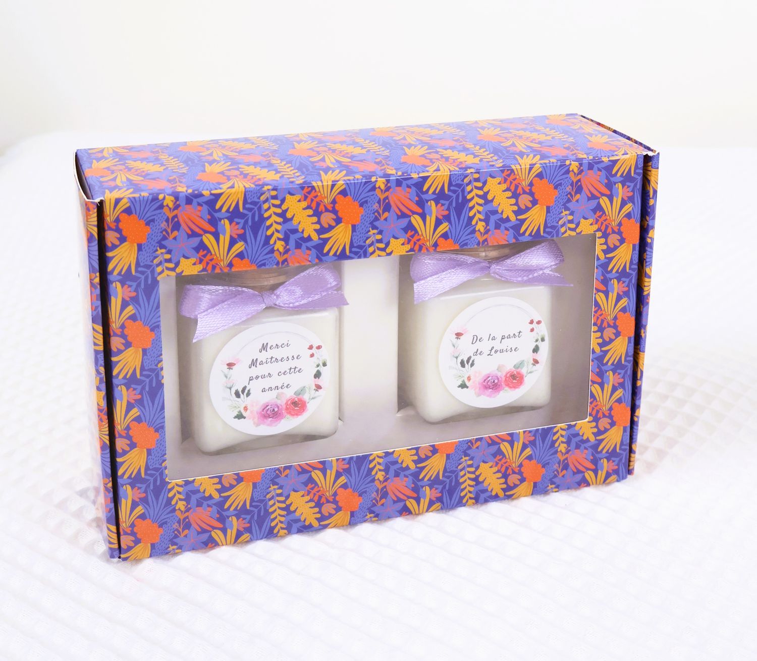 Coffret deux bougies ton violet or orange