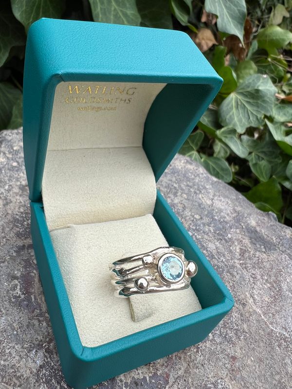 Silver Sky Blue Topaz Cyclone 4 Ring