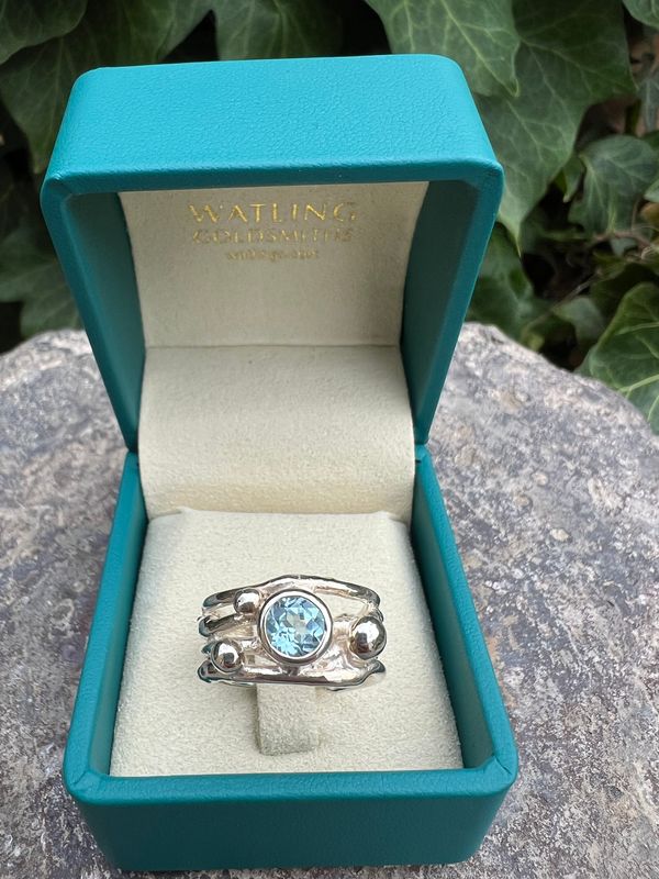 Silver Sky Blue Topaz Cyclone 4 Ring