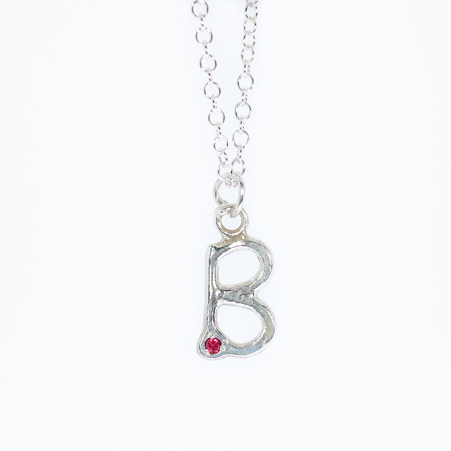 Silver Hammered Ruby Initial Pendant