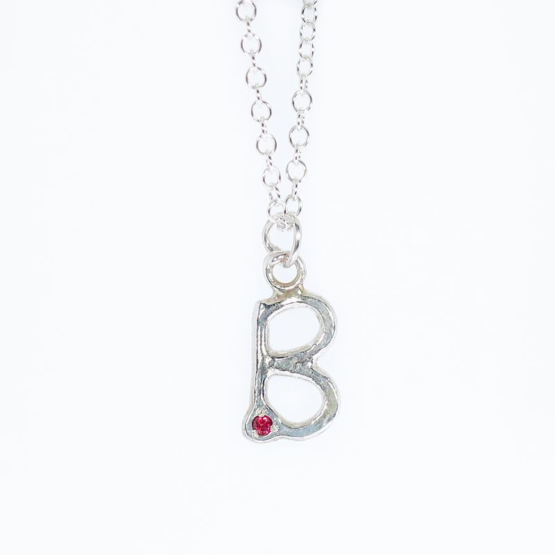 Silver Hammered Ruby Initial Pendant