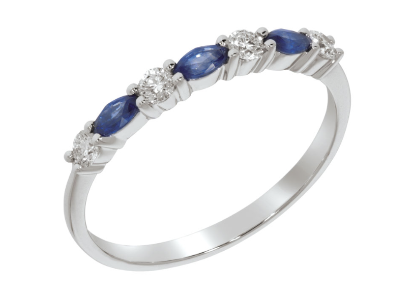 CORONA ring, made of 14. ct. white gold, 0,20 ct. W/SI diamonds, and 0,30 ct. blue sapphires