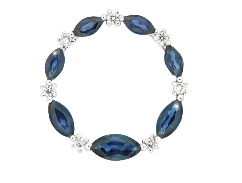 CORONA pendant, made of 14 ct. white gold, 0,10 ct. W/SI diamonds and 1,1 ct. sapphires