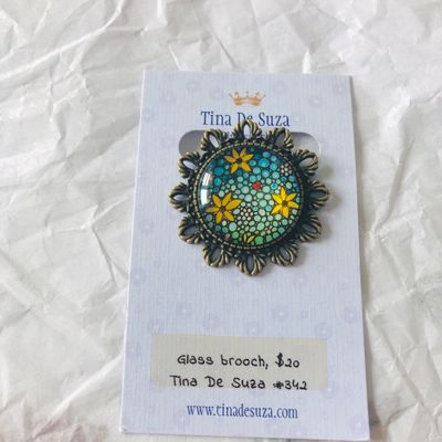 Brooch: Glass with metal frame