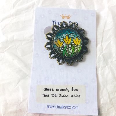 Brooch: Glass with metal frame