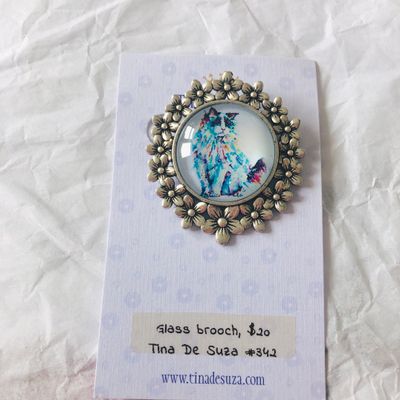 Brooch: Glass with metal frame