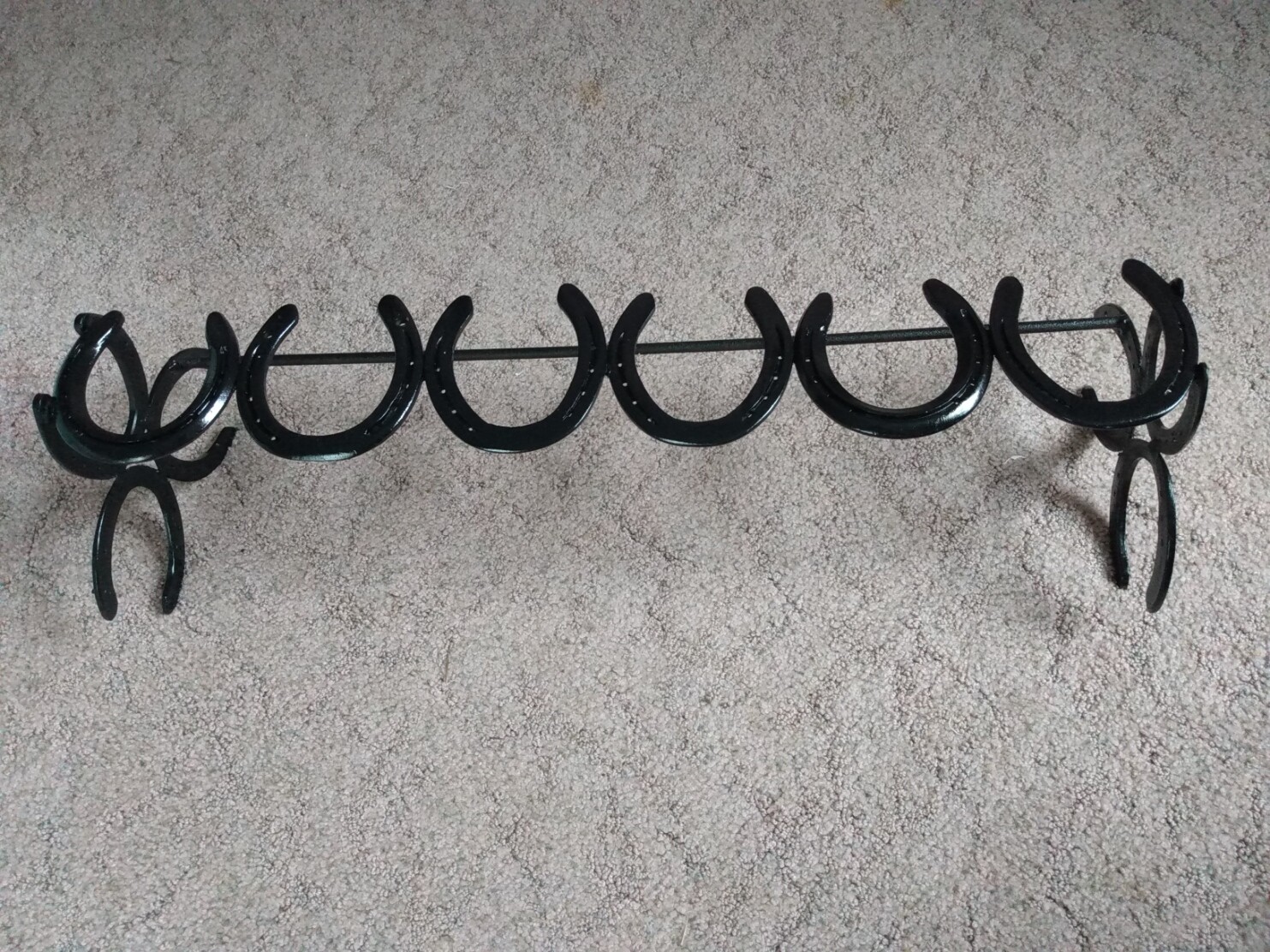 Horse shoe boot rack