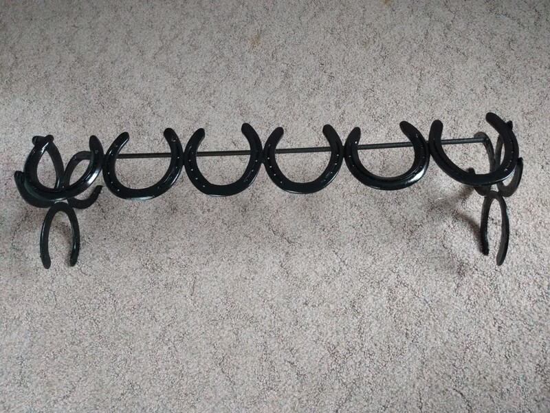 Horse shoe boot rack