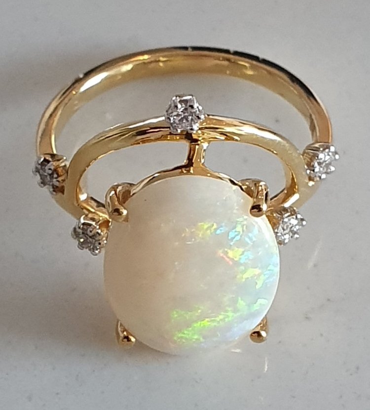 R12  Opal & Diamond Dress Ring Featuring an Oval Solid White Opal Supported by 5 Brilliant Cut Diamonds Claw Set in 9ct Yellow Gold