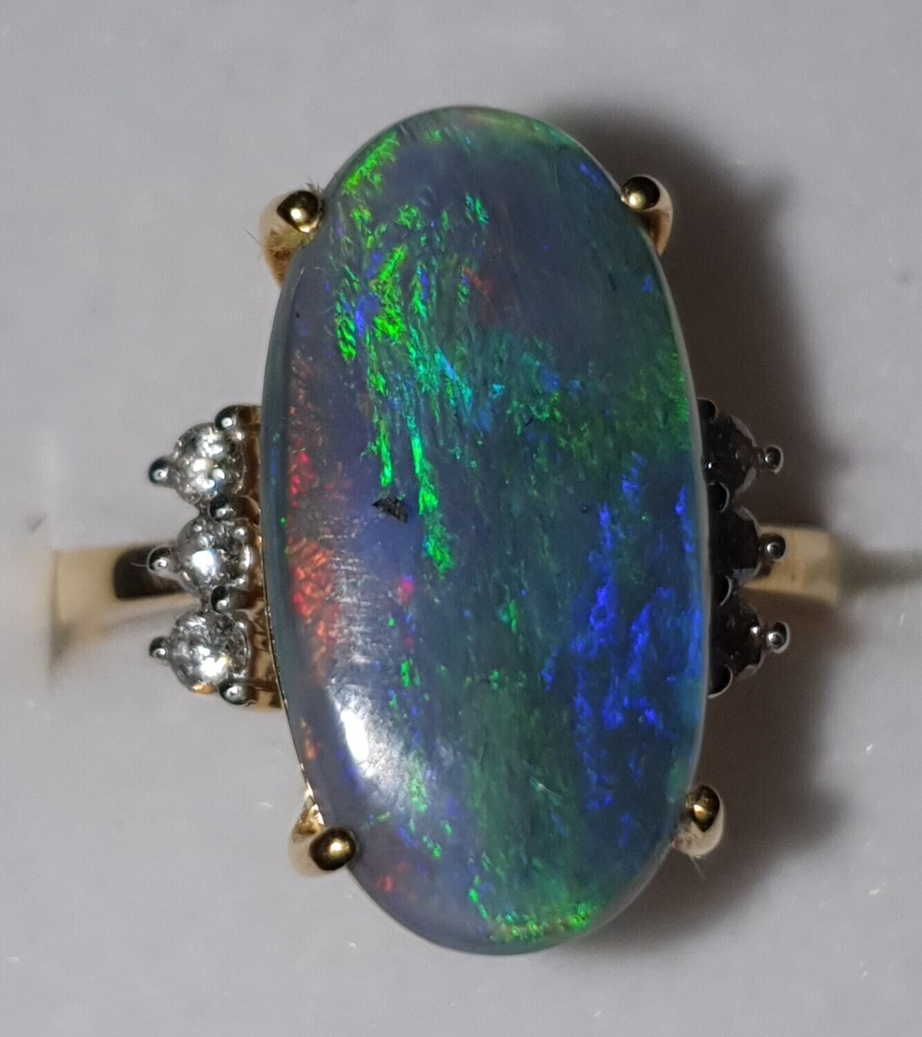 R11  Opal & Diamond Dress Ring, Featuring Semi Black Opal Cabochon Claw Set, Supported by 6 Brilliant Cut Diamonds. 9ct Yellow Gold Set